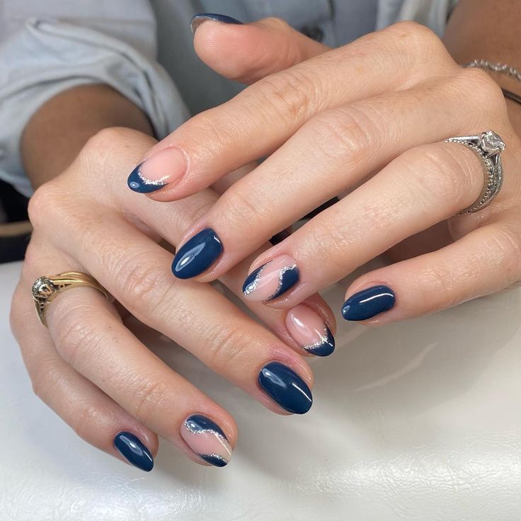 Sophisticated Navy Blue Nail Design with Silver Tips and Modern Wavy Accents.