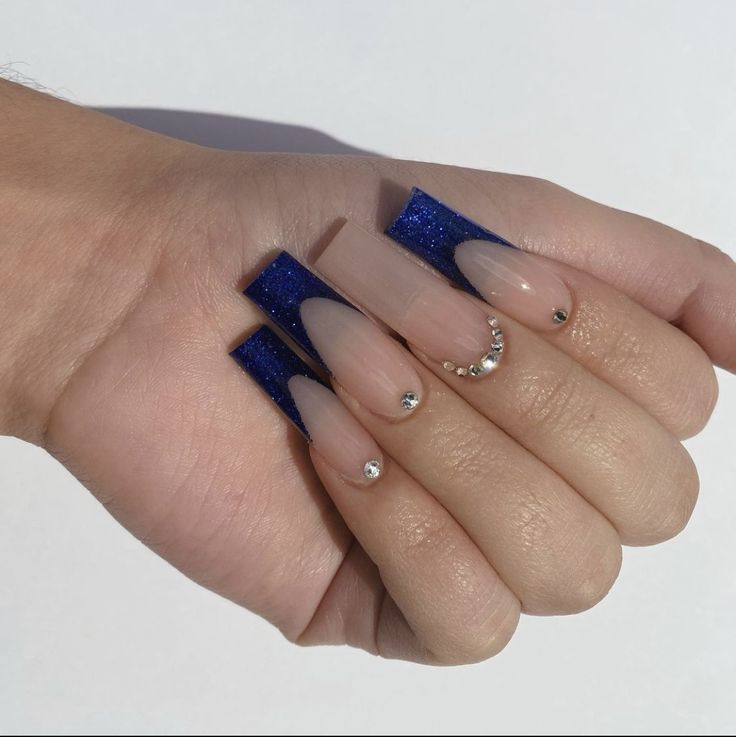 Chic Contemporary Nail Design: Nude and Deep Blue Glitter with Glam Rhinestones