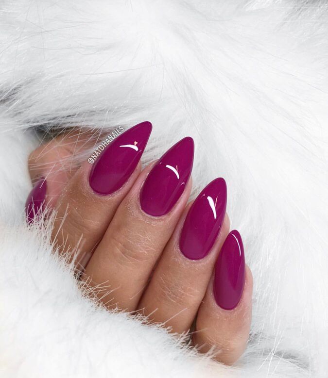 Elegant Magenta Almond Nails with Chic White Accents and Luxurious Fur.