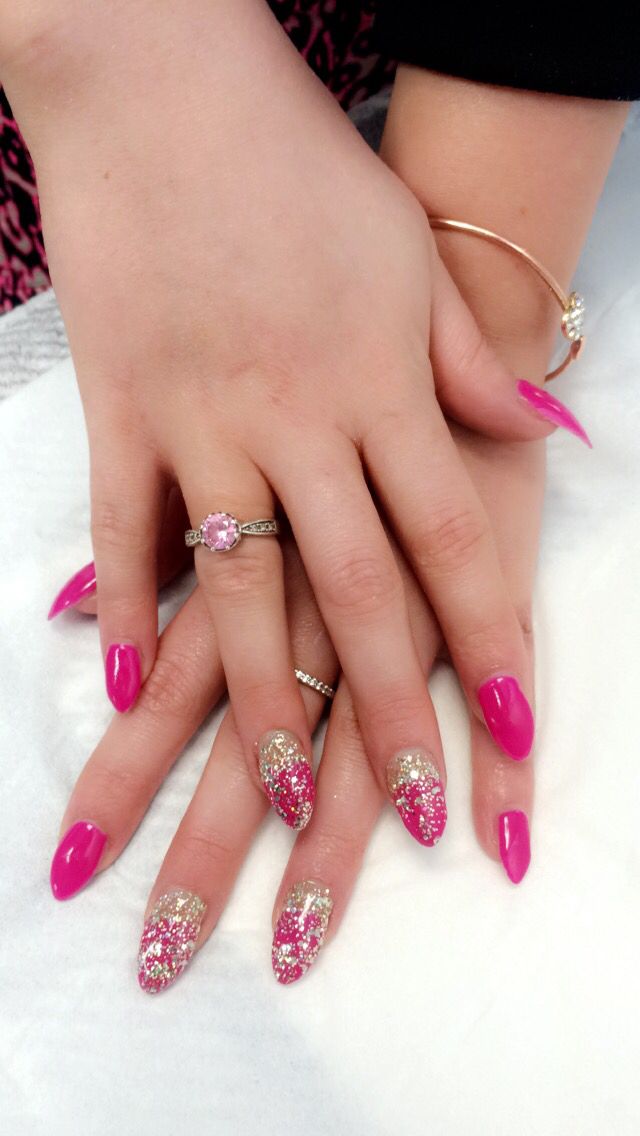 Vibrant Pink Nail Design with Sparkling Ombre Tips: A Playful yet Elegant Statement.