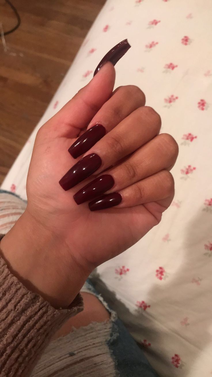 Sophisticated Deep Burgundy Nails: A Glossy Touch of Glamour for Any Occasion.