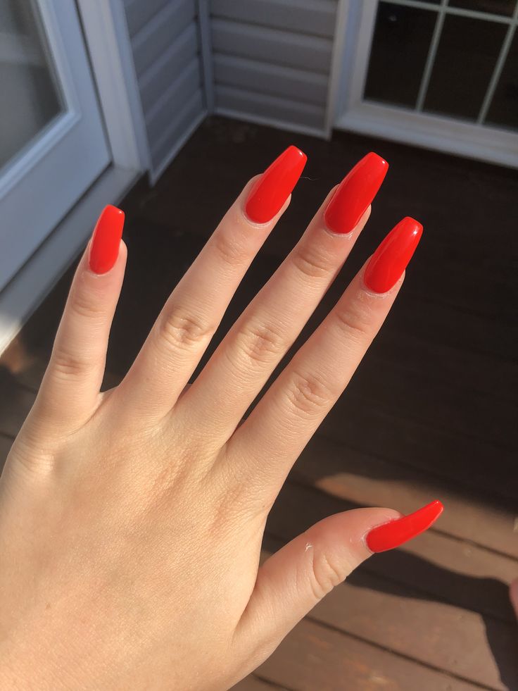 Bold Red Glossy Acrylic Nails for a Confident Style Statement.