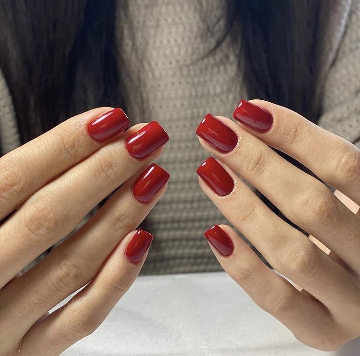 Elegant Glossy Red Manicure with Modern Square Nails for Any Occasion.