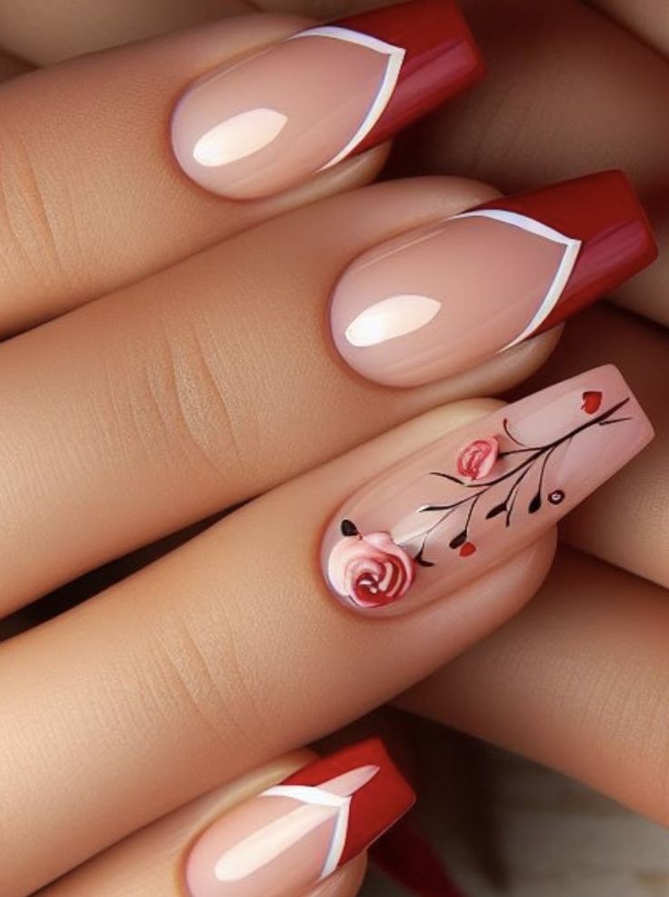 Elegant Red and Nude Nail Design with French Tips and Floral Accents.