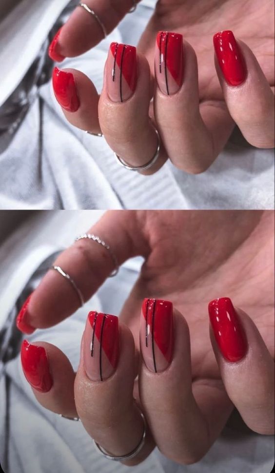 Bold Red Nail Design with Geometric Shapes and Black Accents for a Striking Fashion Statement.