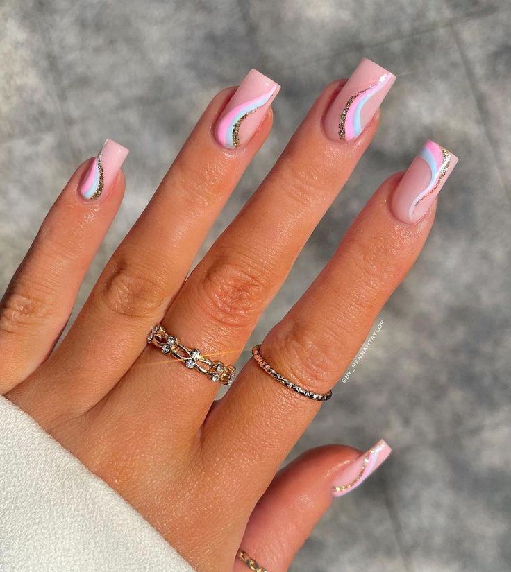 Chic Nail Design with Soft Pink Base, Elegant Waves, and Playful Accents