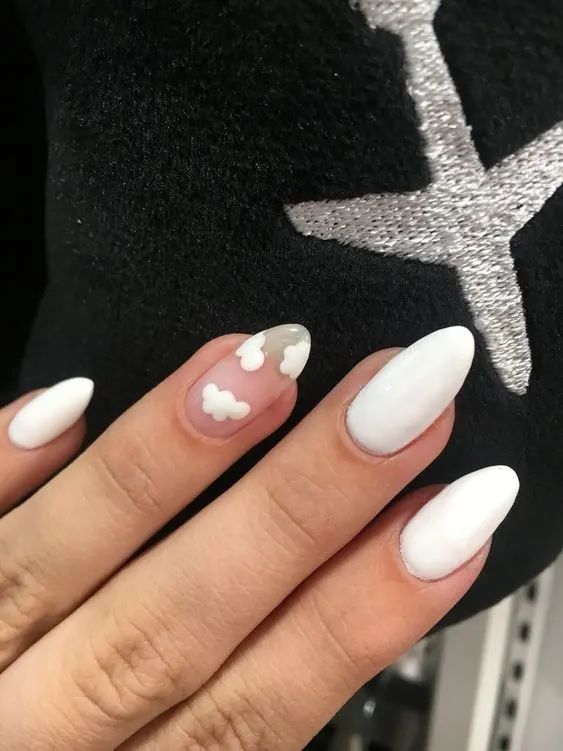 Whimsical Cloud-Inspired Nail Design with Glossy White Base and Pastel Accents.