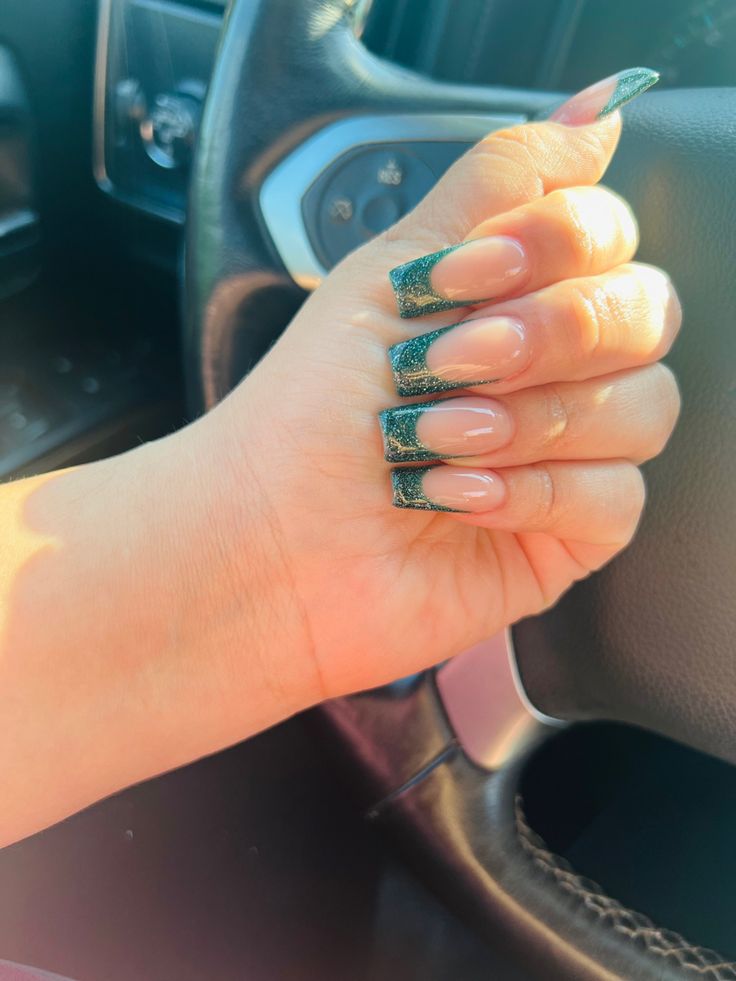 Elegant Gradient Manicure: Long Square Nails with Shimmering Dark Green Tips.