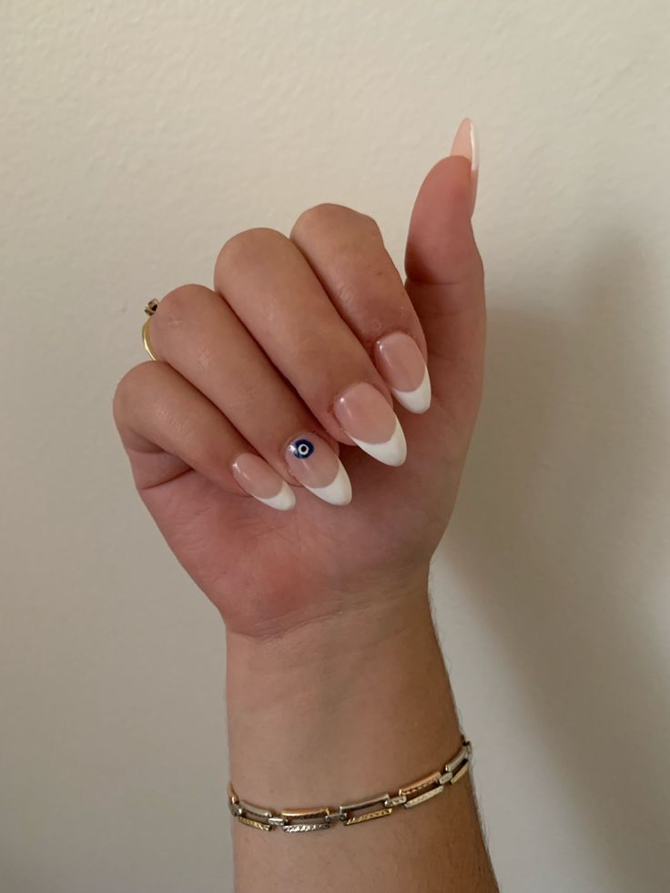 Sophisticated French Manicure with Creative Eye Design.