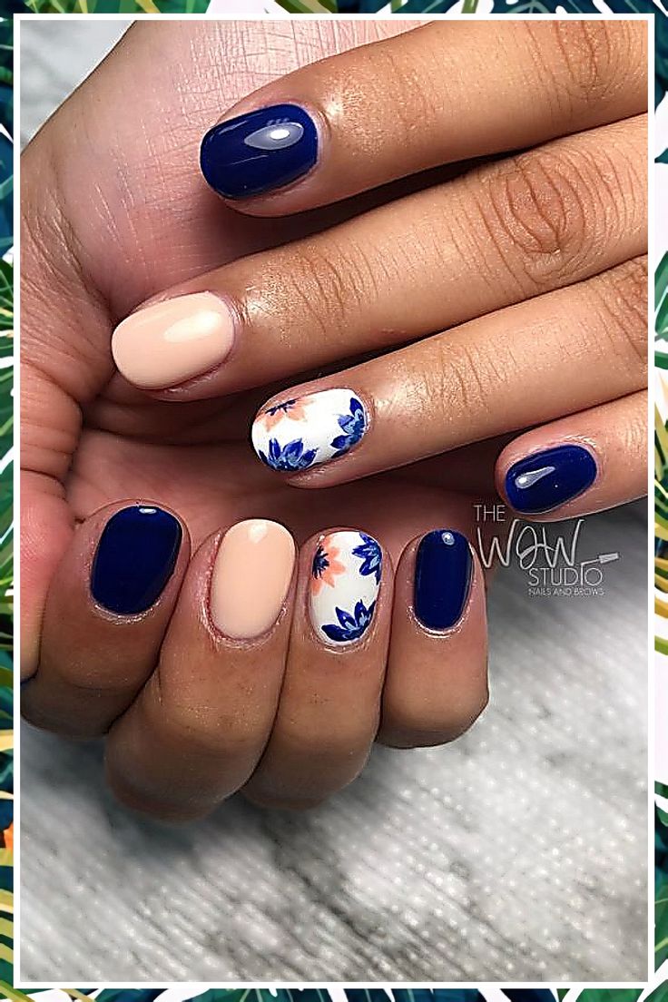 Chic Navy and Beige Nail Design with Elegant Floral Accents