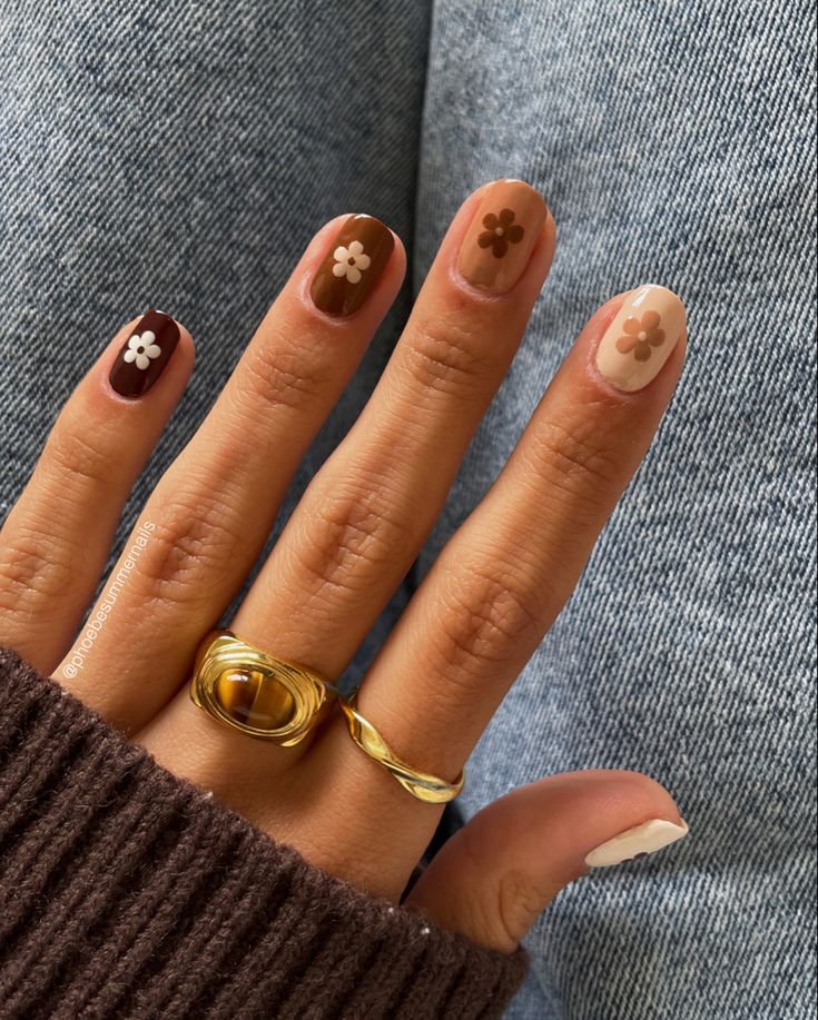 Charming Pastel and Earthy Toned Nail Art with Floral Accents