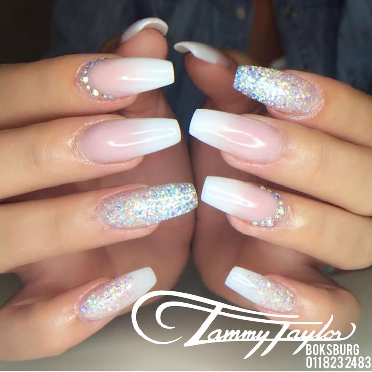 Chic Gradient Nail Design with Pink and White Tones, Holographic Glitter, and Rhinestones.