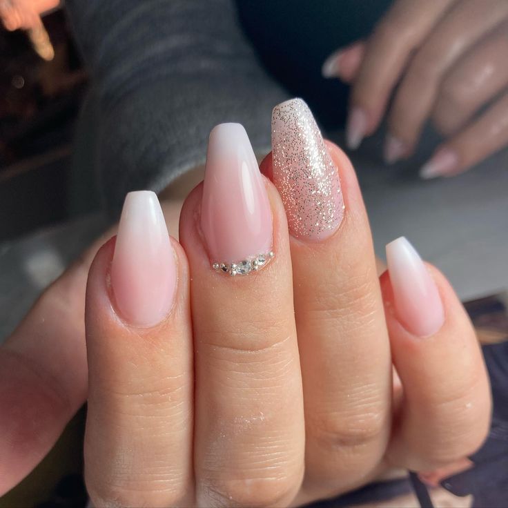 Chic Soft Pink Nail Design with Glitter Accents for Elegance and Versatility.