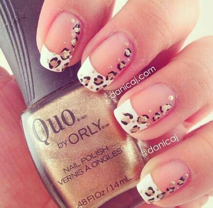 Chic French Manicure Elevated with Playful Leopard Print and Glamorous Gold Base