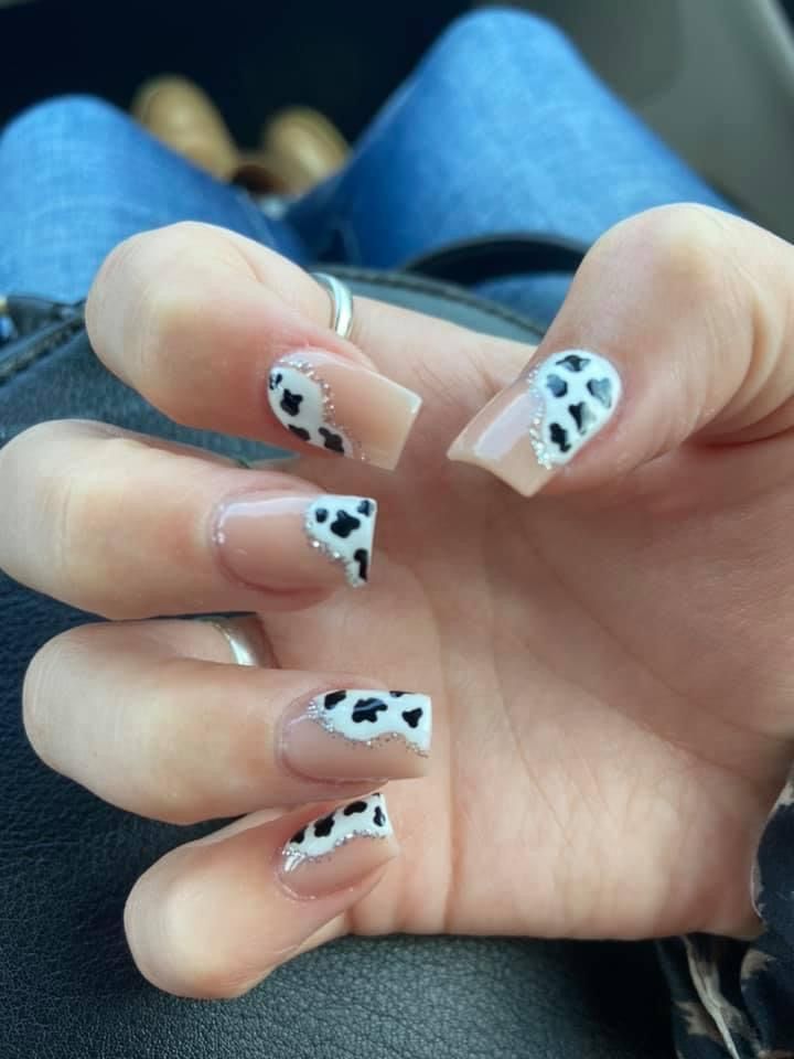 Chic Cow Print Nail Design with Elegant Detailing