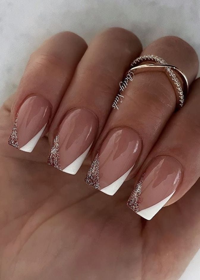 Chic Nude and White Nail Design with Glitter Accents for Effortless Glam.