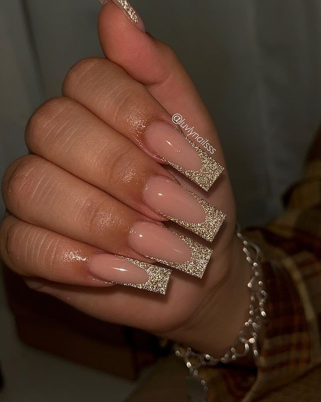 Elegant Nude Nail Design with Glittery Tips for Chic Sophistication.