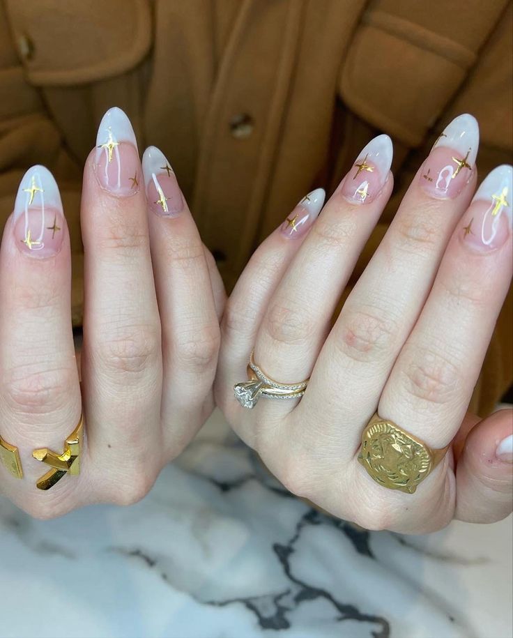 Sophisticated French Tip Nail Design with Modern Gradient and Gold Cross Accents