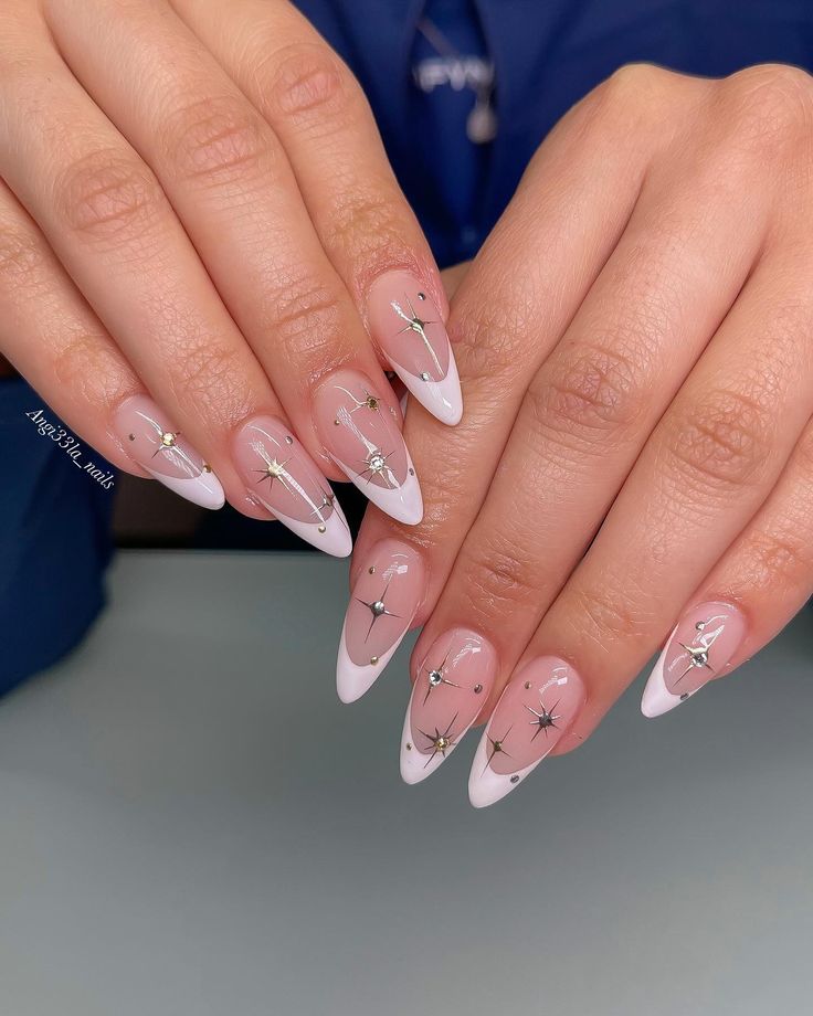 Chic Almond-Shaped Nails with Gradient Pink, White Tips, and Celestial Silver Stars.