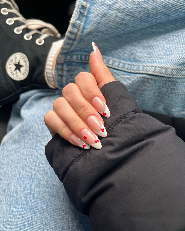 Chic French Tip Nail Design with Vibrant Red Heart Accents