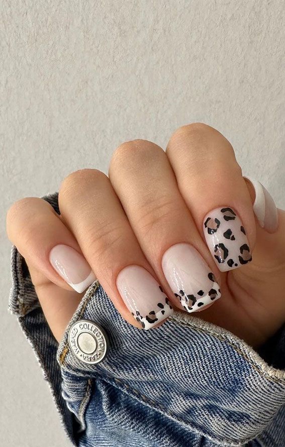 Chic Neutral Nail Design with Bold Leopard Accents for Modern Elegance.