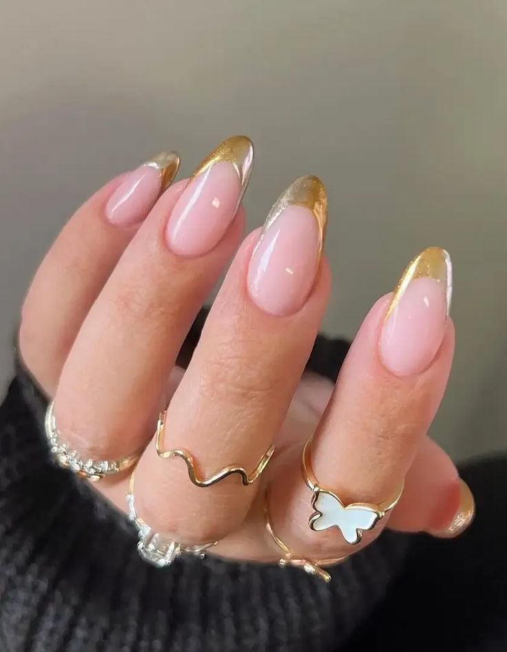 Chic Soft Pink and Gold Nail Design with Elegant Accents