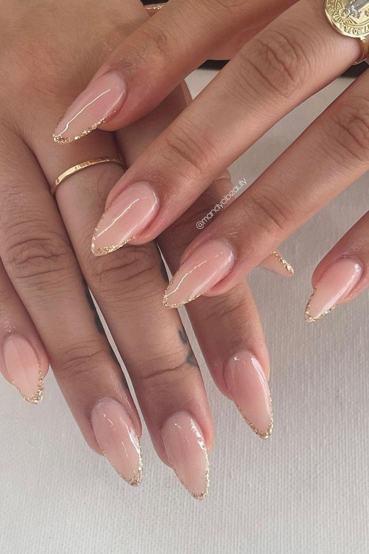 Chic Nude Nail Design with Gold Accents for Understated Sophistication.