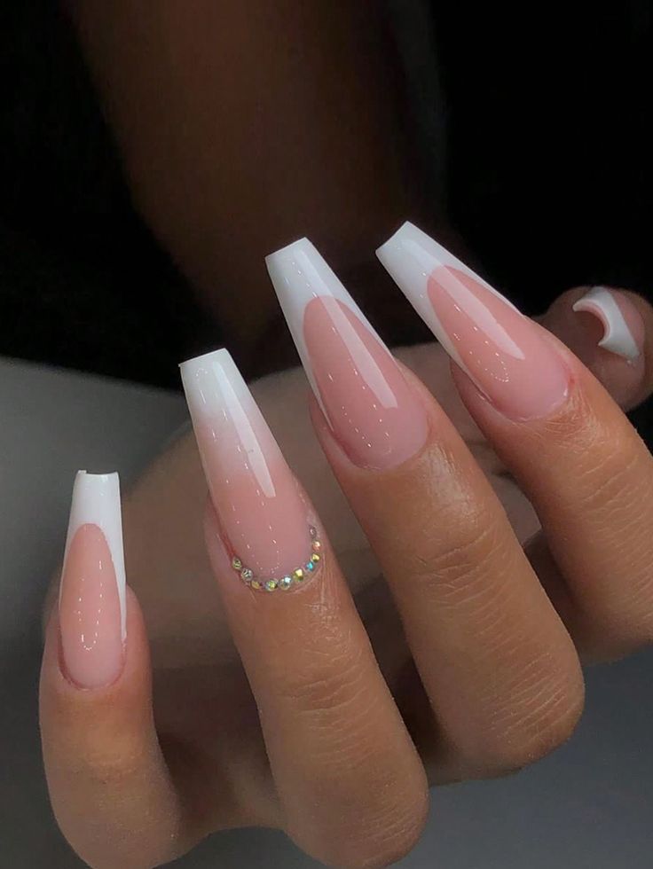 Chic Pink and White Nail Design with Glossy Finish and Rhinestone Accents.