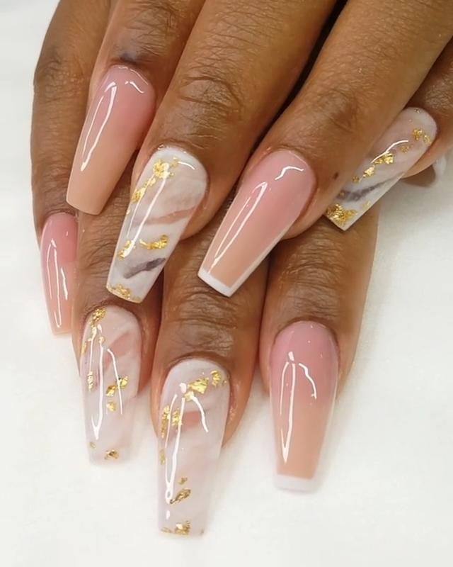 Sophisticated Soft Pink and Marble Nail Design with Luxurious Gold Accents.