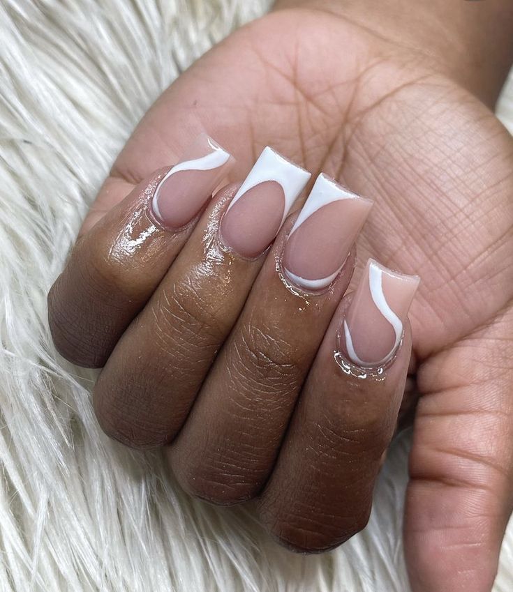 Modern French Manicure with Nude and White Colors, Wavy Lines, and Sparkling Accents.