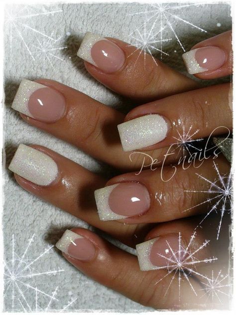 Sophisticated Gradient Nail Design with Nude and White Glitter Tips.