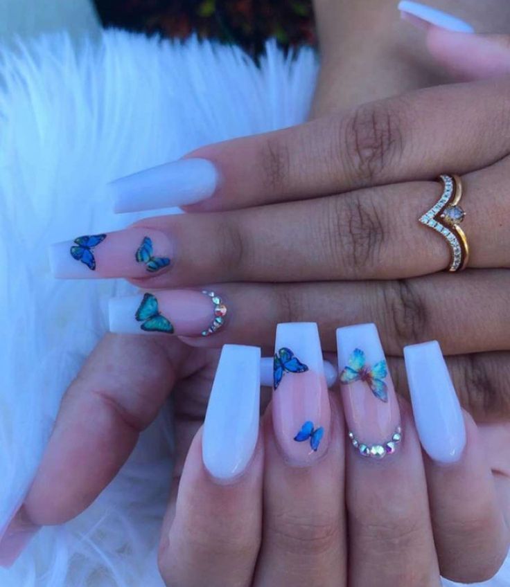 Elegant Pastel Nail Art with Butterfly Motifs and Sparkling Accents.