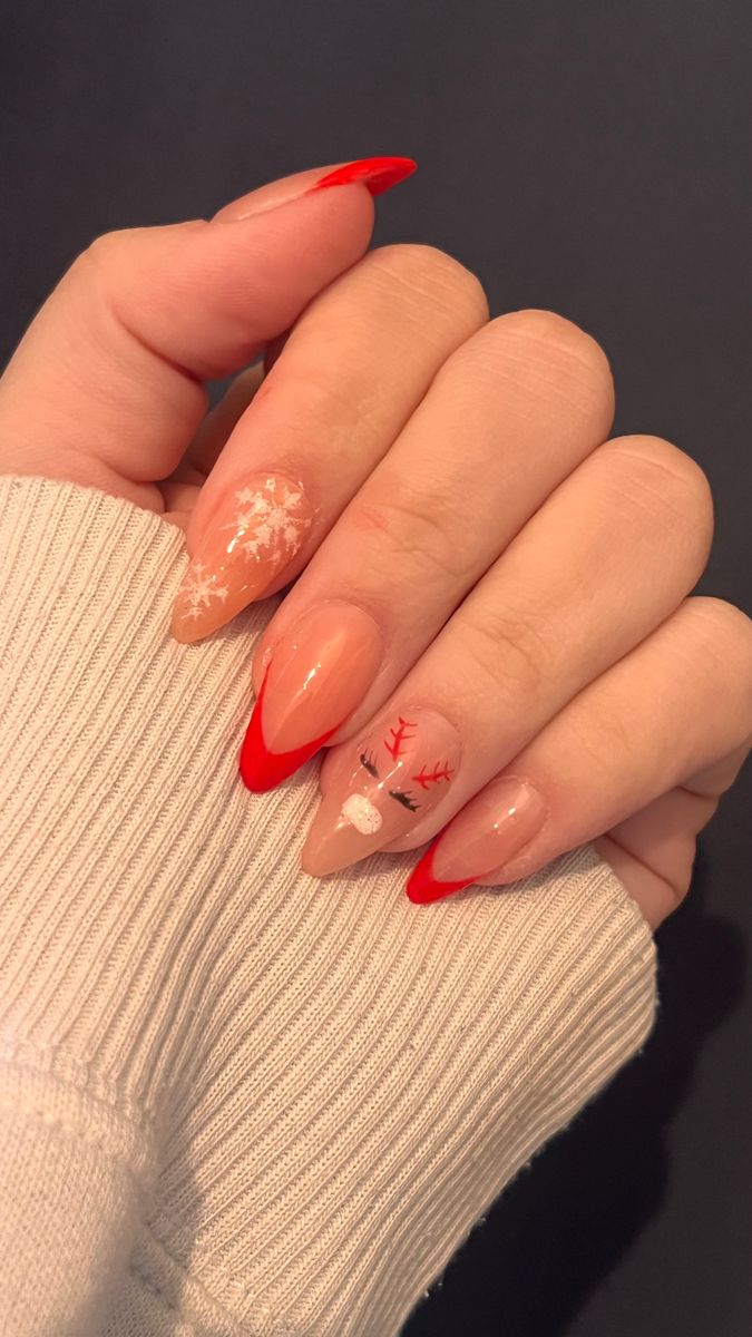 Chic Holiday Nail Design: Vibrant Red Tips with Reindeer and Snowflake Art