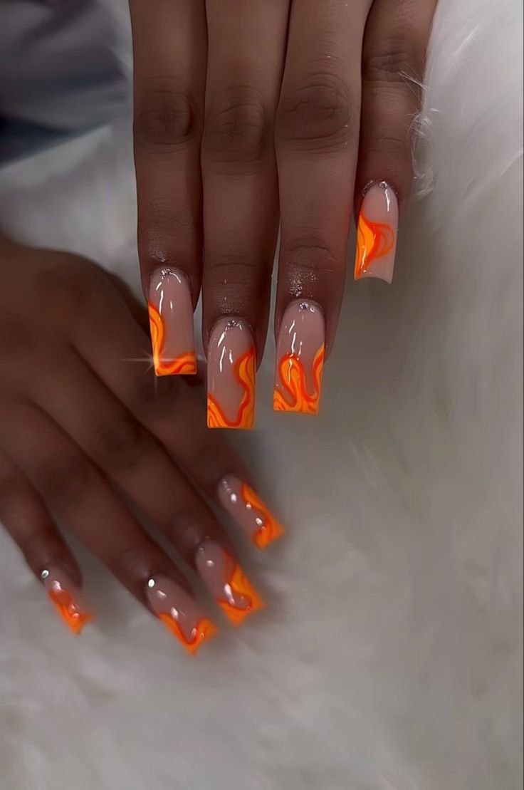 Striking Gradient Orange Swirl Nail Design with Glossy Finish