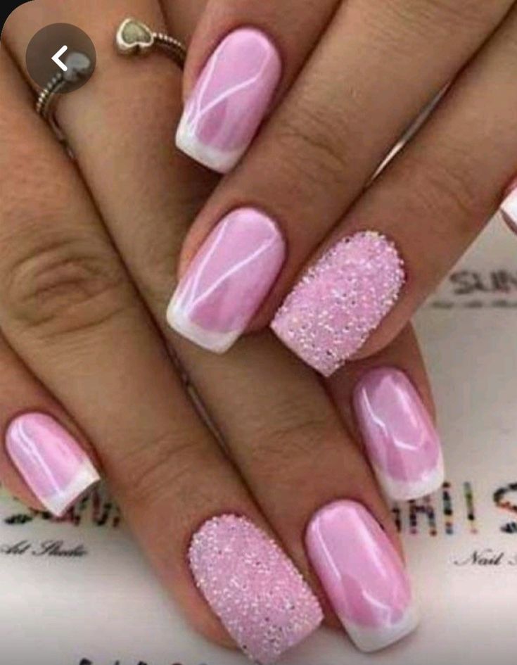 Elegant Soft Pink Marble Nail Design with Glitter Accent.