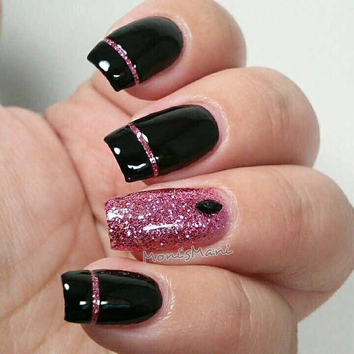 Chic Black and Glittery Pink Nail Design: A Glamorous Blend of Sleek Elegance and Delicate Accents.