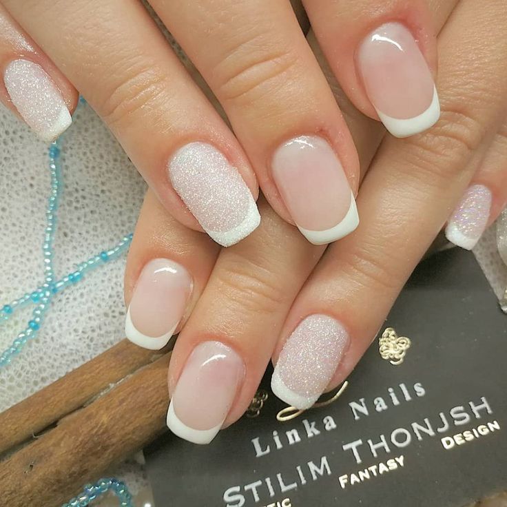 Chic Twisted French Manicure: Glamorous Pink and White Design with Sparkling Accents.