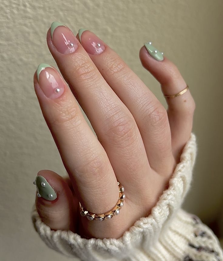 Chic Nail Design: Soft Pink and Pastel Green with Elegant French Tips and Pearls.