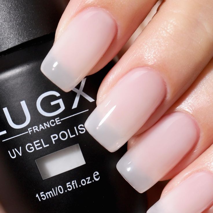 Sophisticated Ombre Nude Nail Design: Sheer Pink to Light Cream Transition.