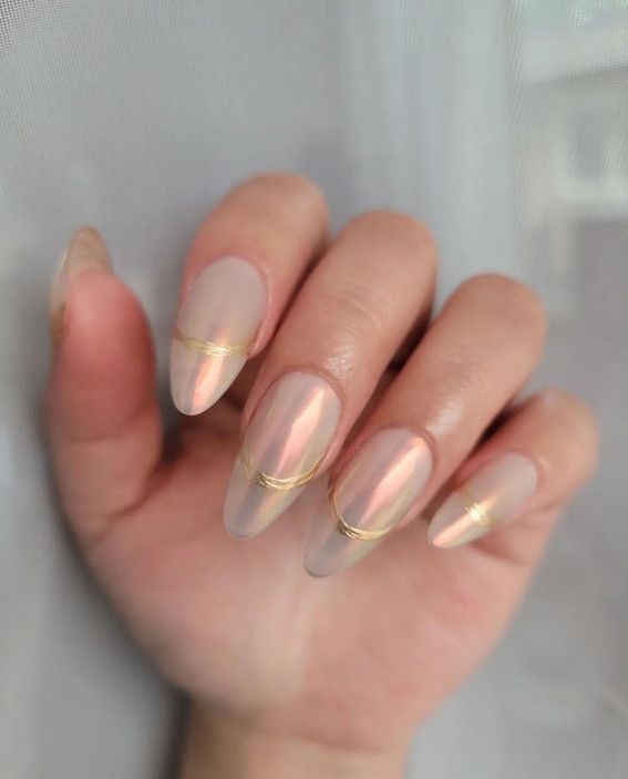 Elegant Almond-Shaped Nail Design with Nude and Iridescent Finishes Highlights Sophistication.