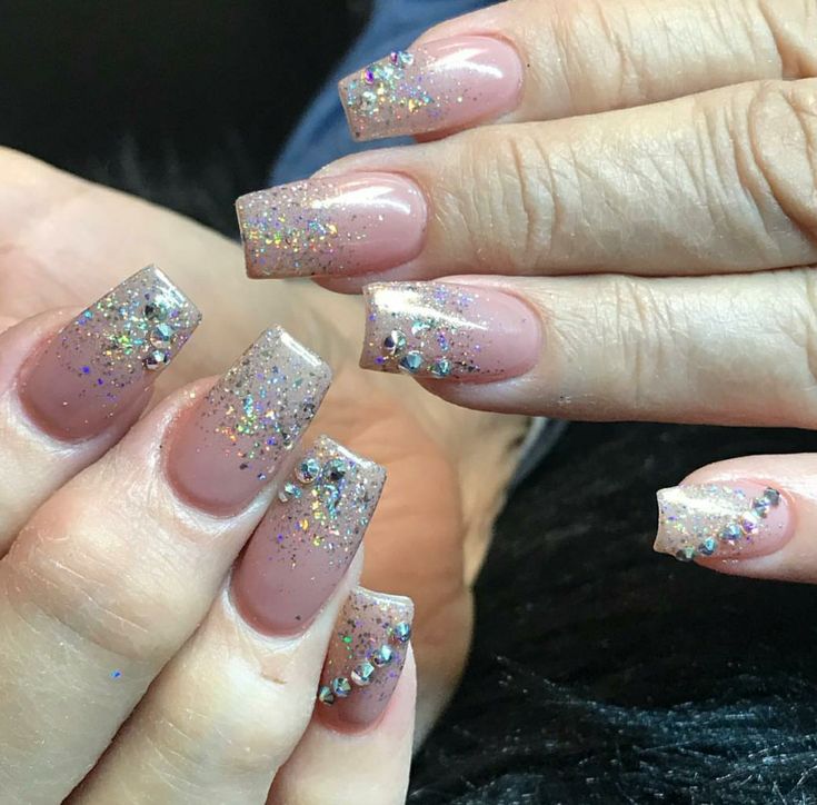 Glamorous Ombre Nail Design with Glitter Accents and Rhinestones