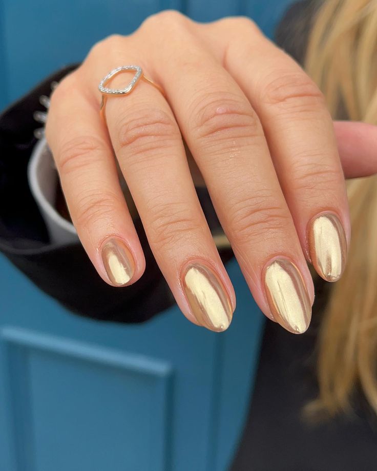 Elegant Metallic Gold Almond-Shaped Nail Design for Any Occasion.