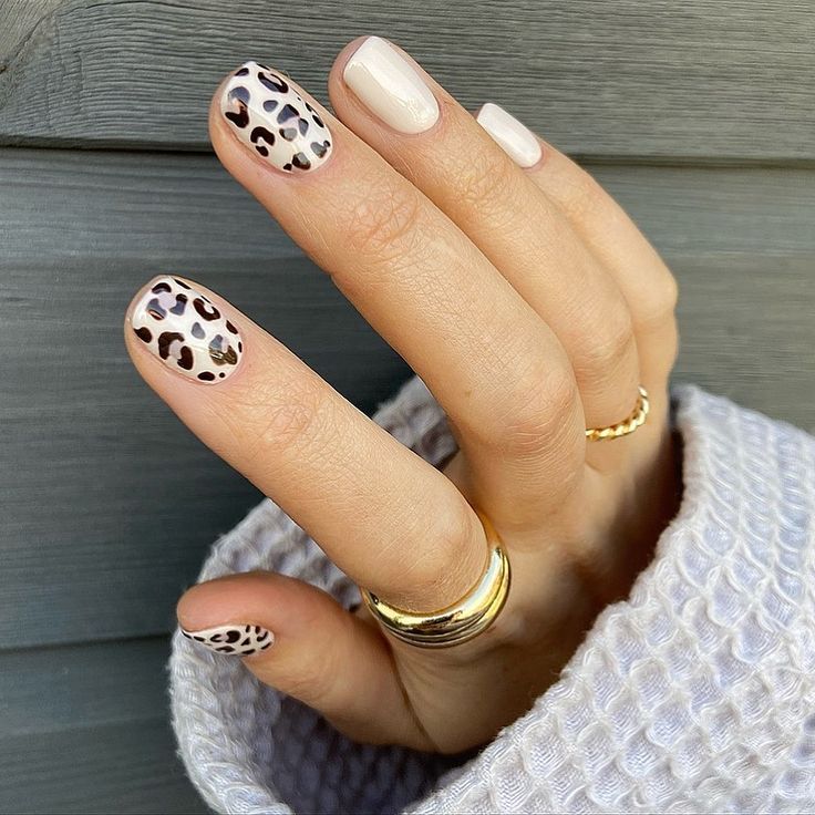 Chic Leopard Print Nails in Neutral Palette with Elegant Accents.