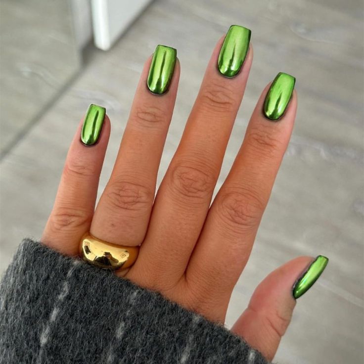 Bold Metallic Green Nails with Glossy Finish and Chic Gold Accents.