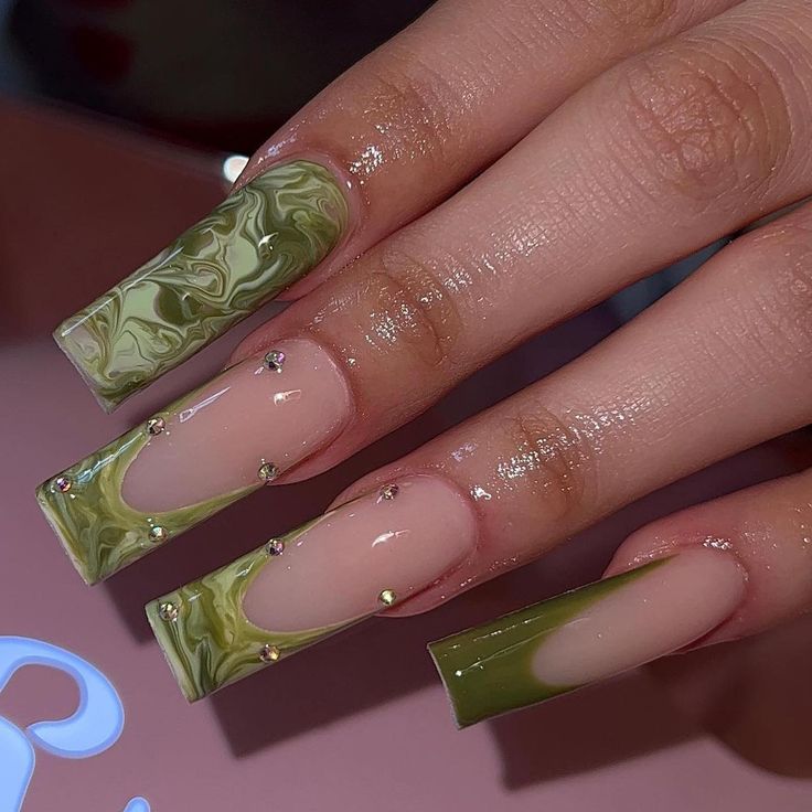 Sophisticated Green Marbled Nail Design with Nude Tones and Glamorous Rhinestones