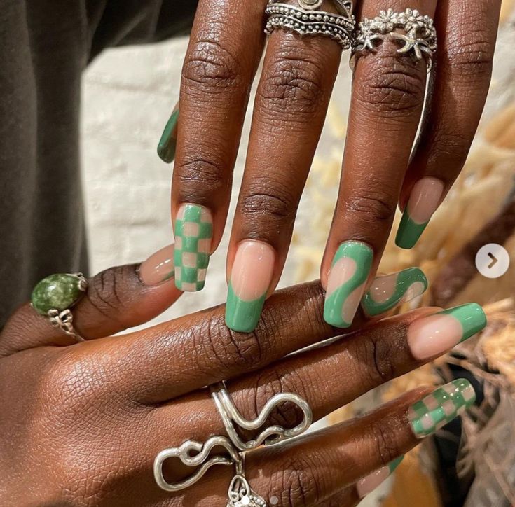 Vibrant Green Geometric Nail Design with Stylish Rings for a Trendy Aesthetic