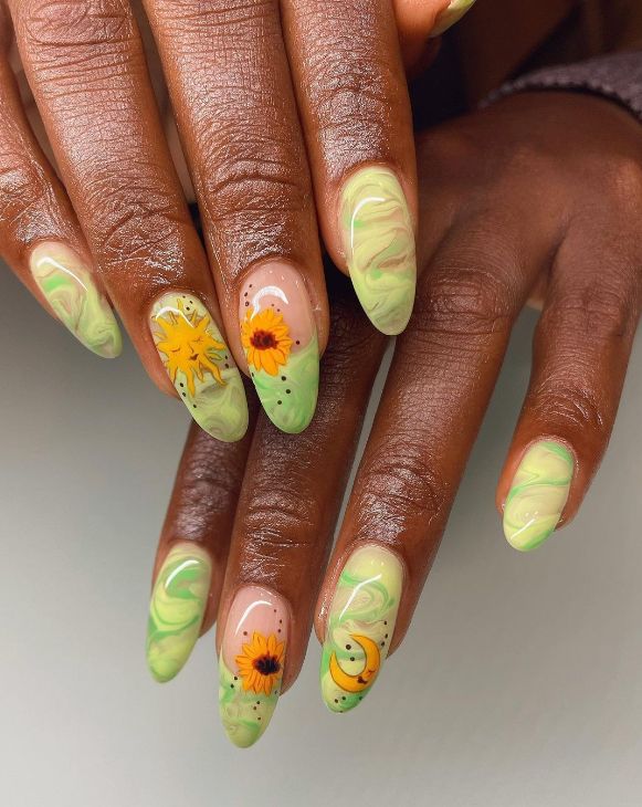 Elegant Soft Green Marble Nail Design with Cheerful Floral and Citrus Motifs.