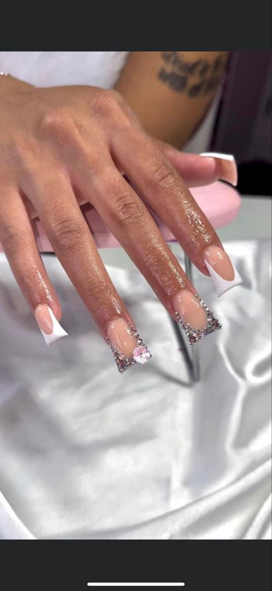 Chic French Manicure: Elegant Blend of Classic and Modern with Rhinestones and Gemstone Accents.