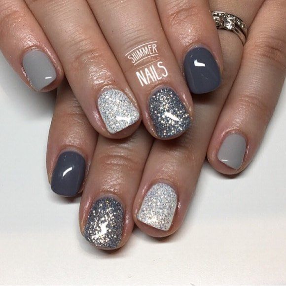 Elegant Nail Design: Muted Grey and Pastel Shades with Glamorous Silver Glitter and Matte Finish.