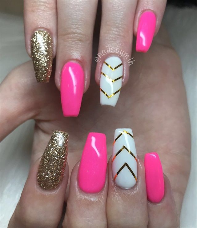 Bold and Elegant: A Playful Manicure with Bright Pink, Sparkling Gold, and Chic White Accents.